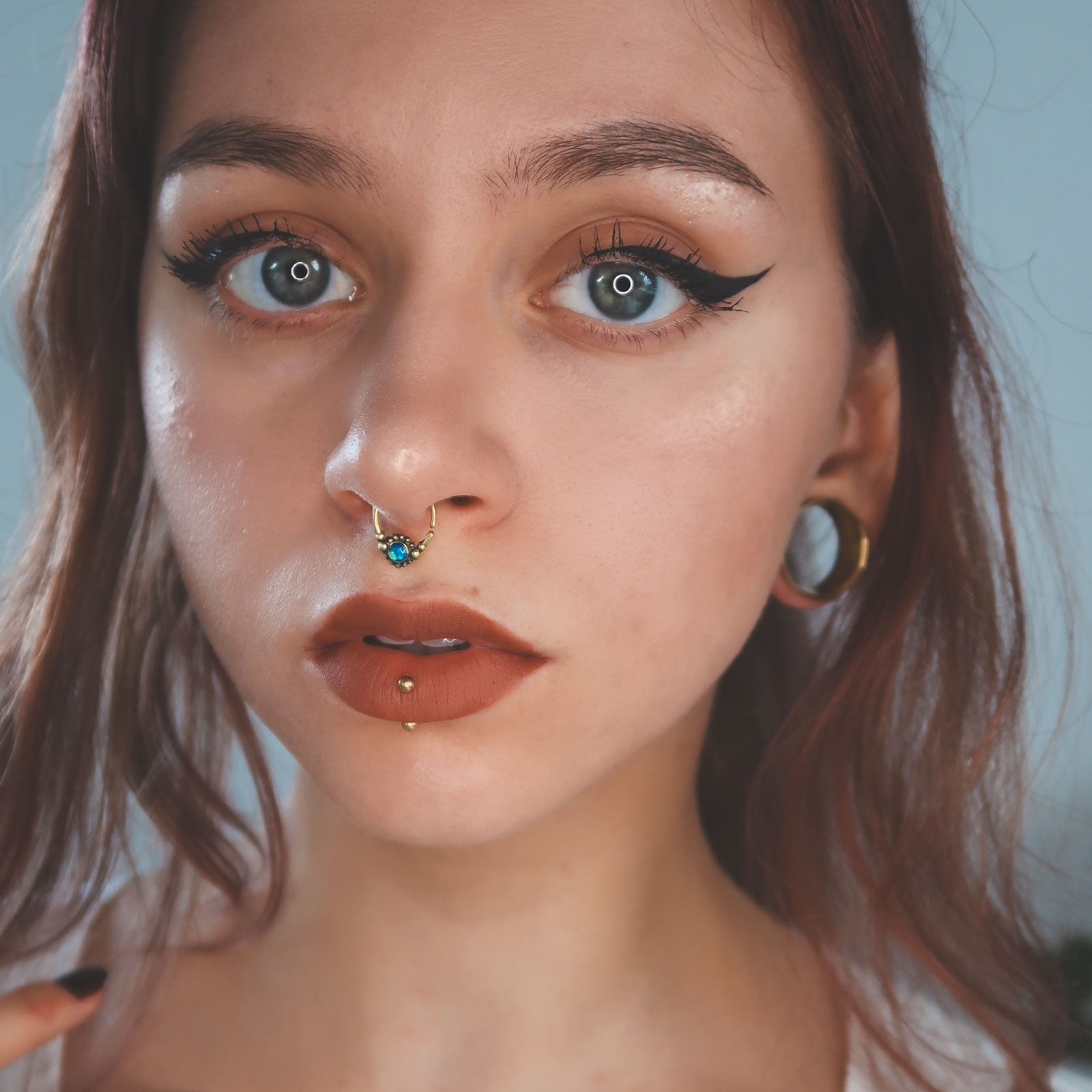 Model With Stretched Ears and Piercings