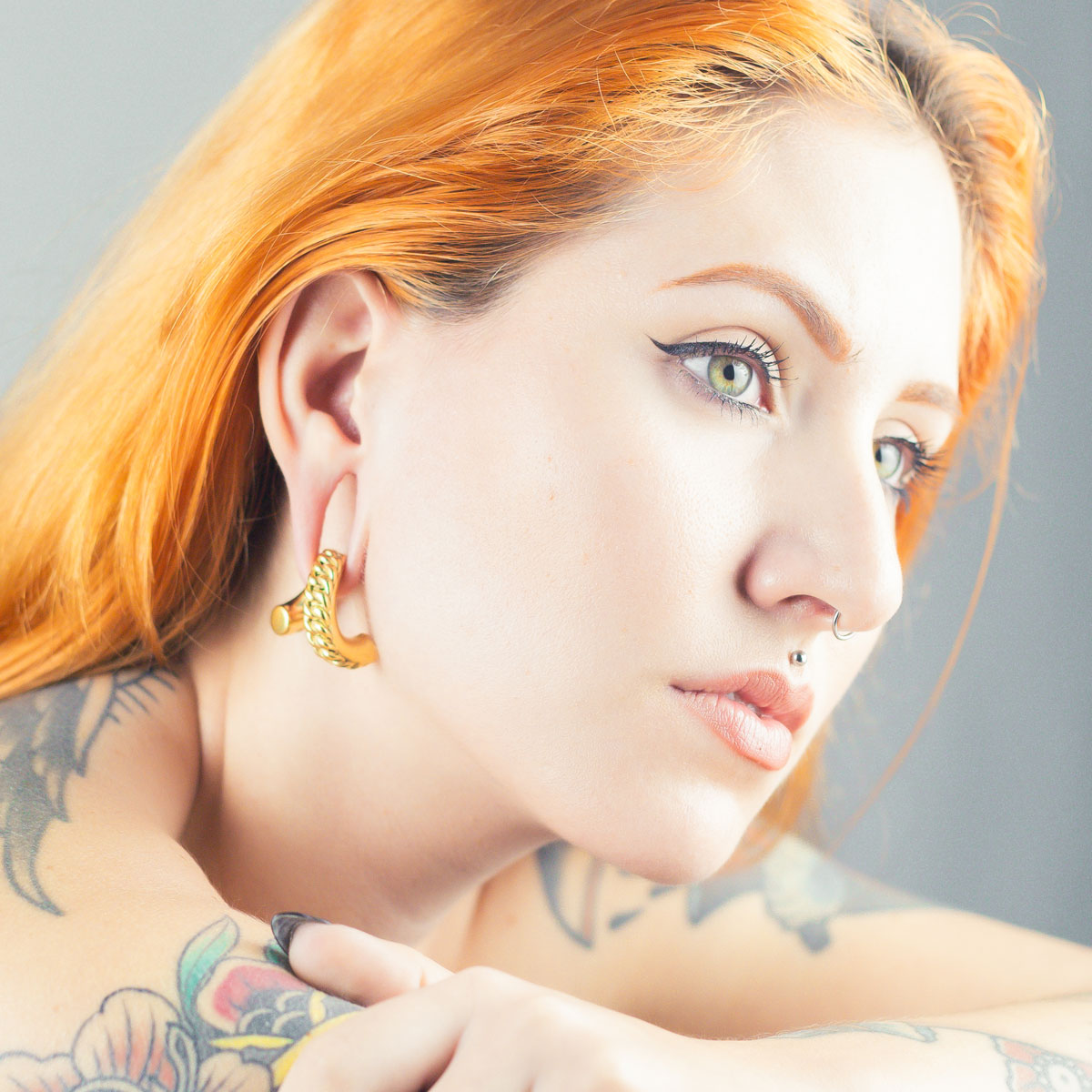 Model With Stretched Ears Wearing Ear Weights