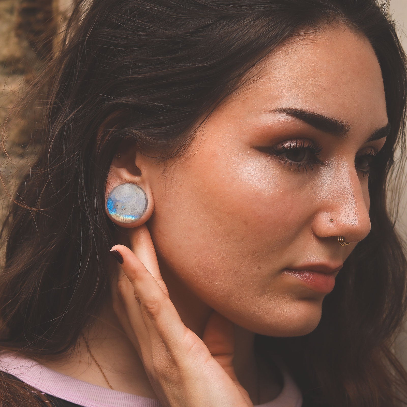 Model With Stretched Ears Wearing Ear Weights