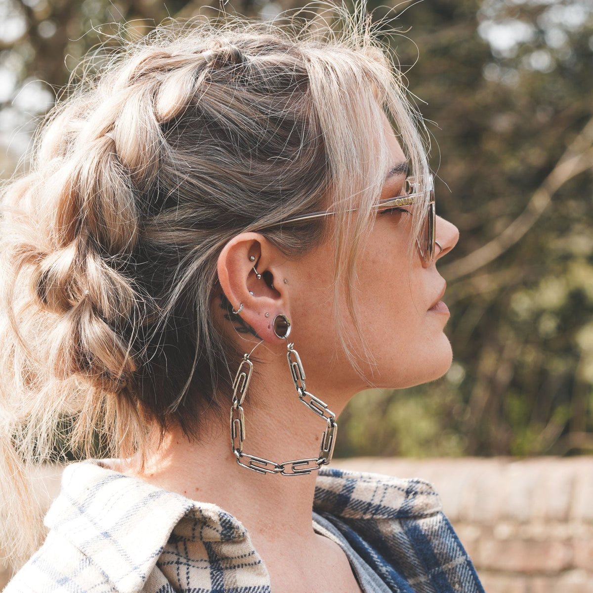 Model With Stretched Ears And Ear Piercings