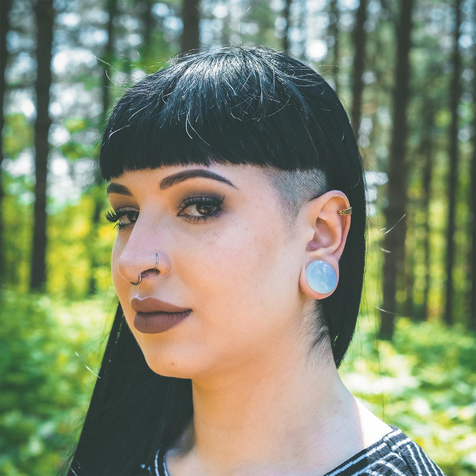 Model With Stretched Ears Wearing Ear Weights