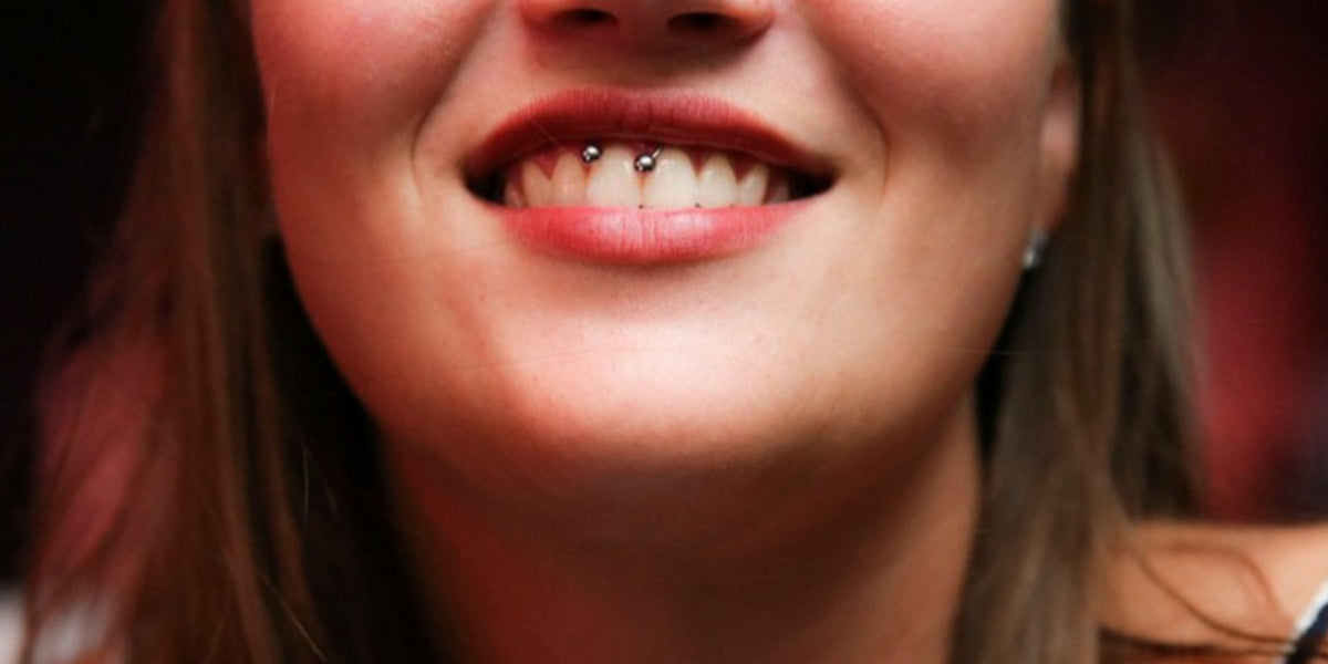 Smiley piercing jewellery - ring on the upper lip frenulum