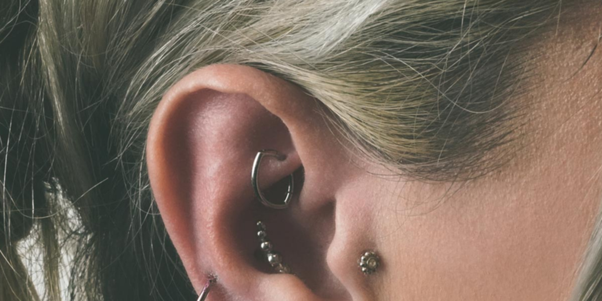 Daith piercing jewellery - hinged ring in a daith piercing