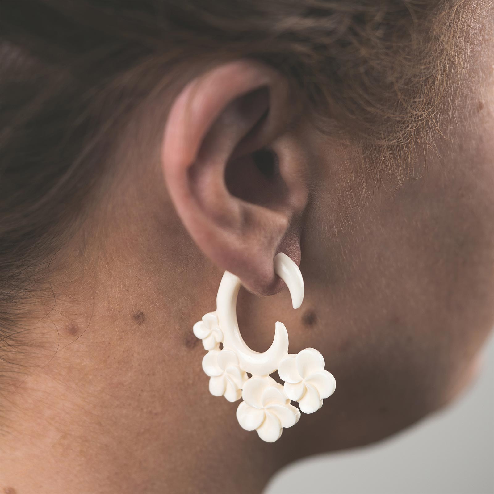 Bone Fake Gauge Hanging Spiral With Four Flower Carving Model Shot