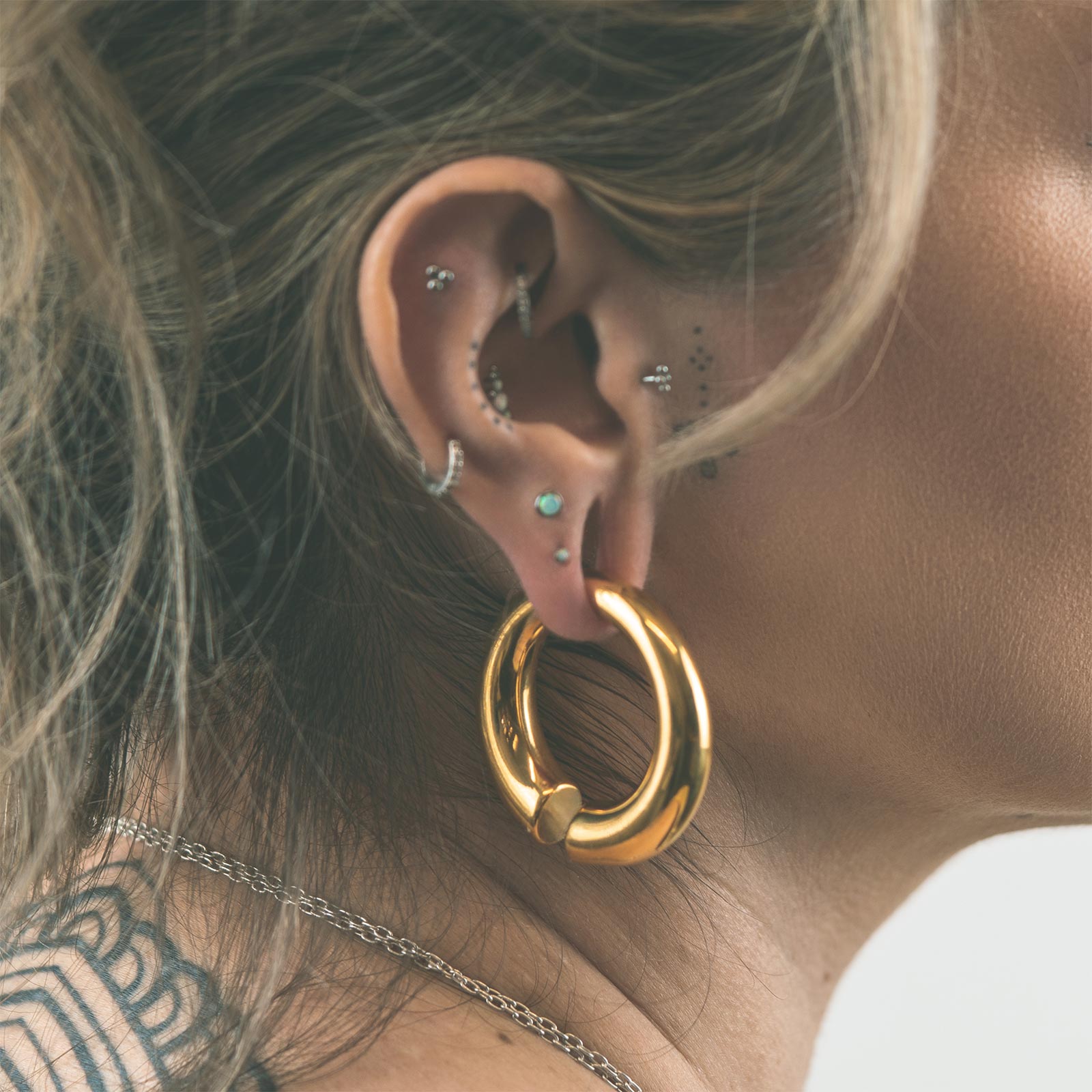 Circular Gold PVD Surgical Steel Ear Weight Model Shot