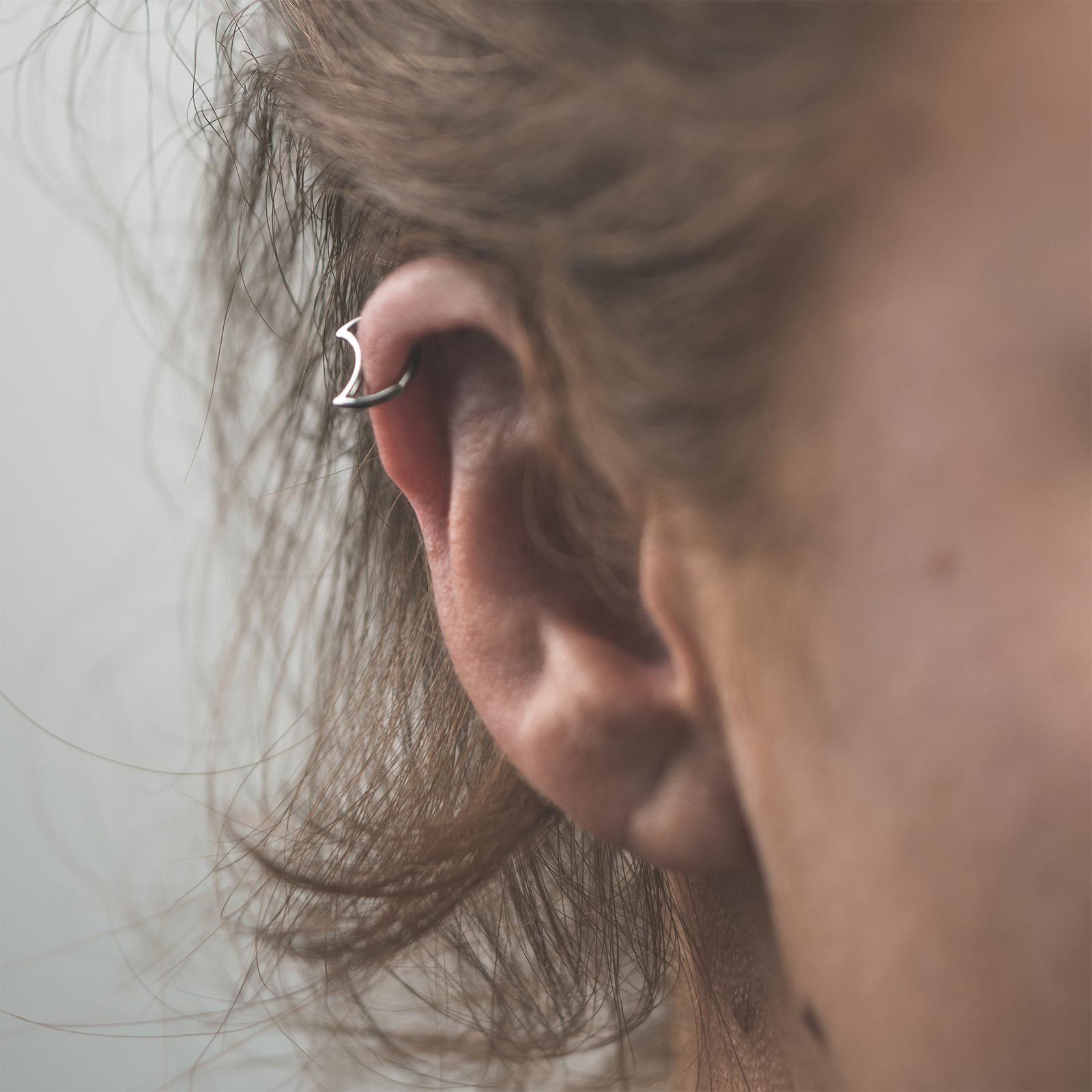 Crescent Titanium Hinged Segment Daith Earring Model Shot