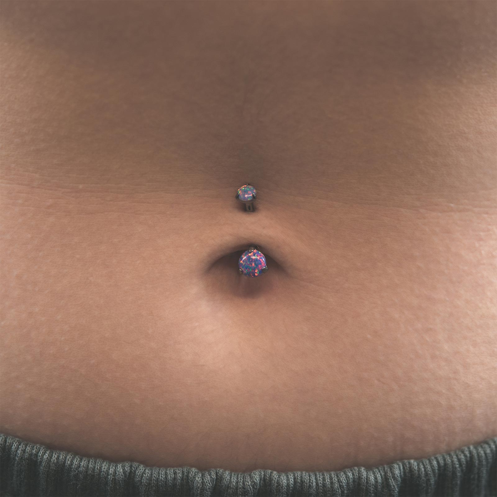 Double Flash Lavender Synth Opal Internally Threaded Titanium Belly Bar Model Shot