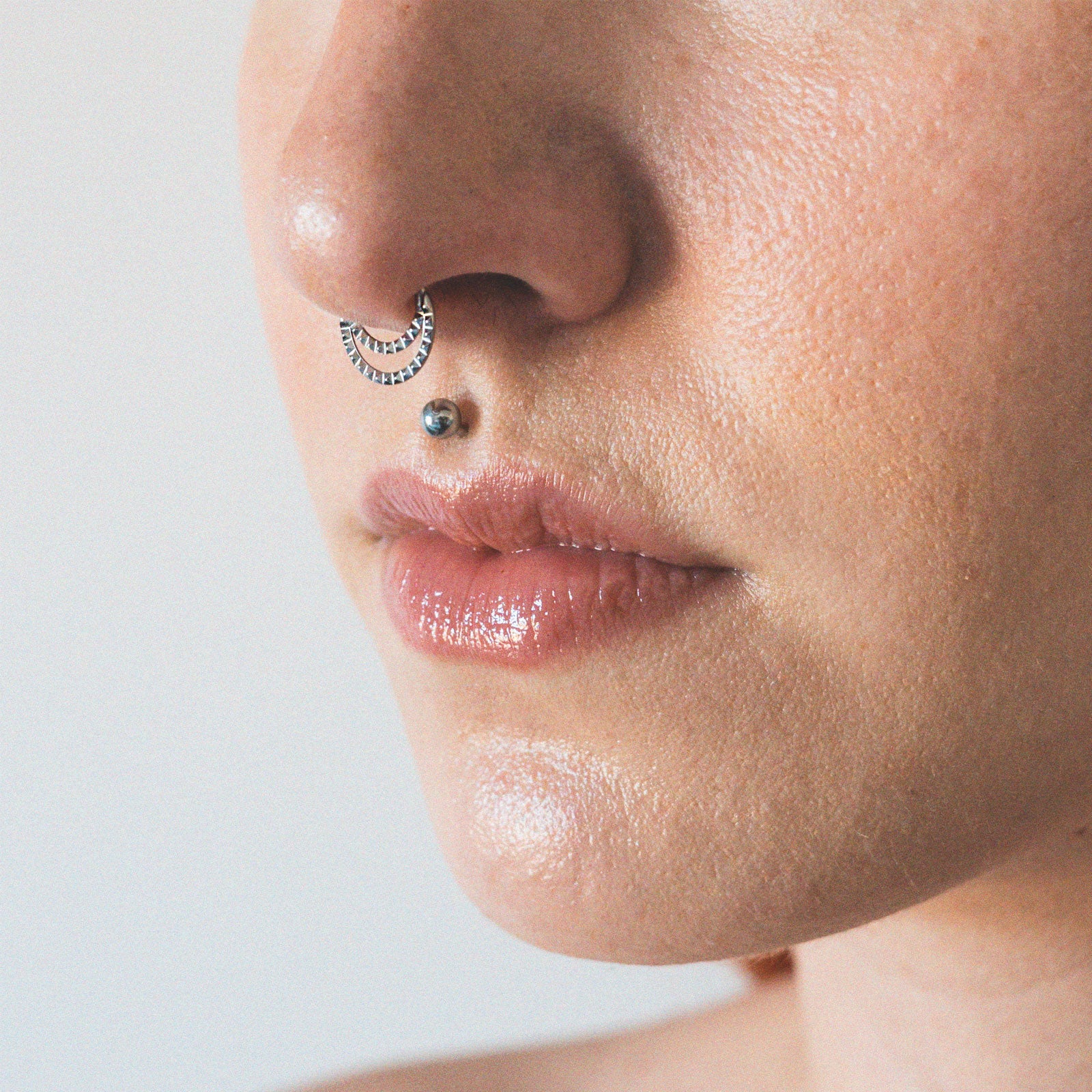 Double Hoop Pyramid Titanium Septum Clicker Ring Model Shot