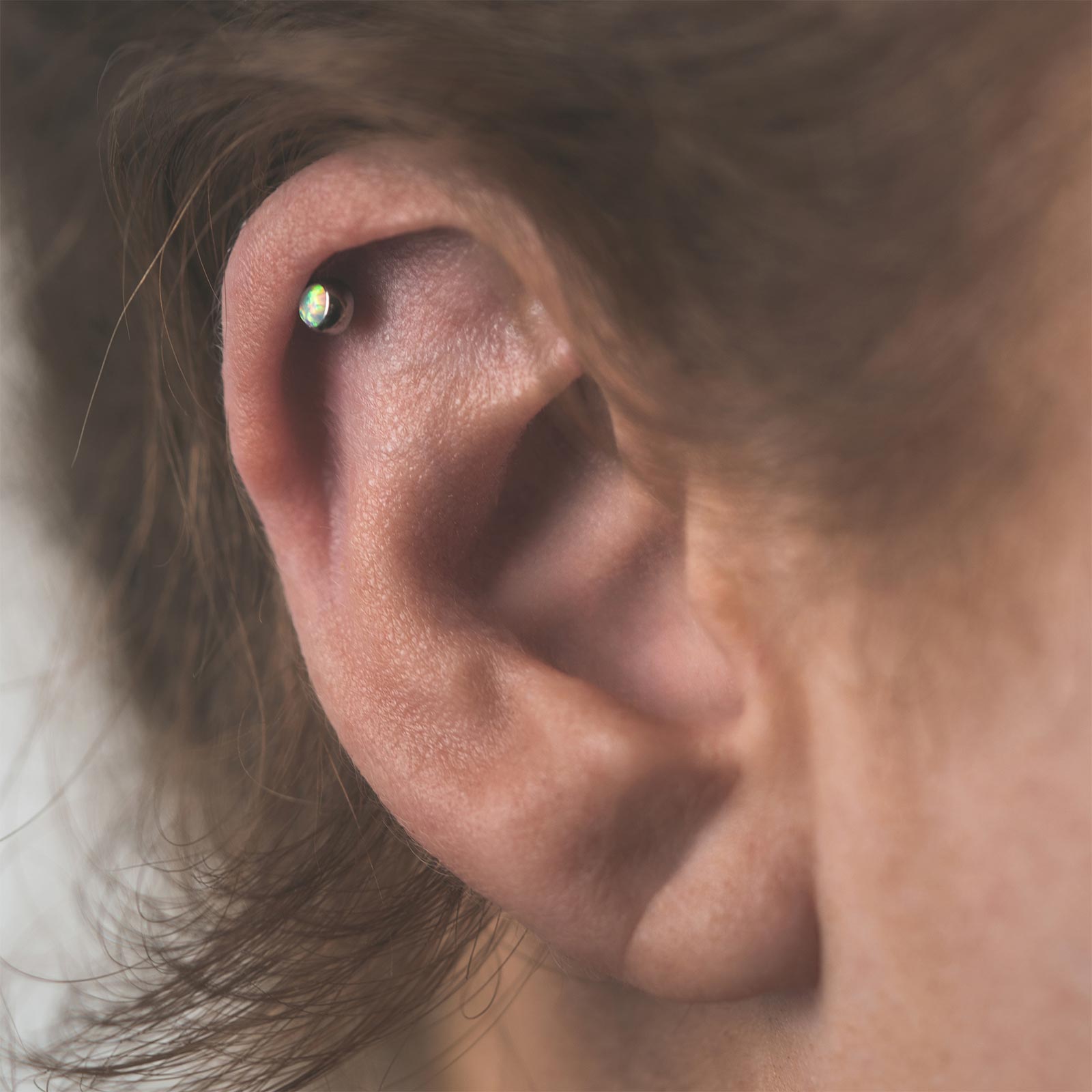 Fire & Snow Front Facing Synth Opal Titanium Threadless Top Model Shot