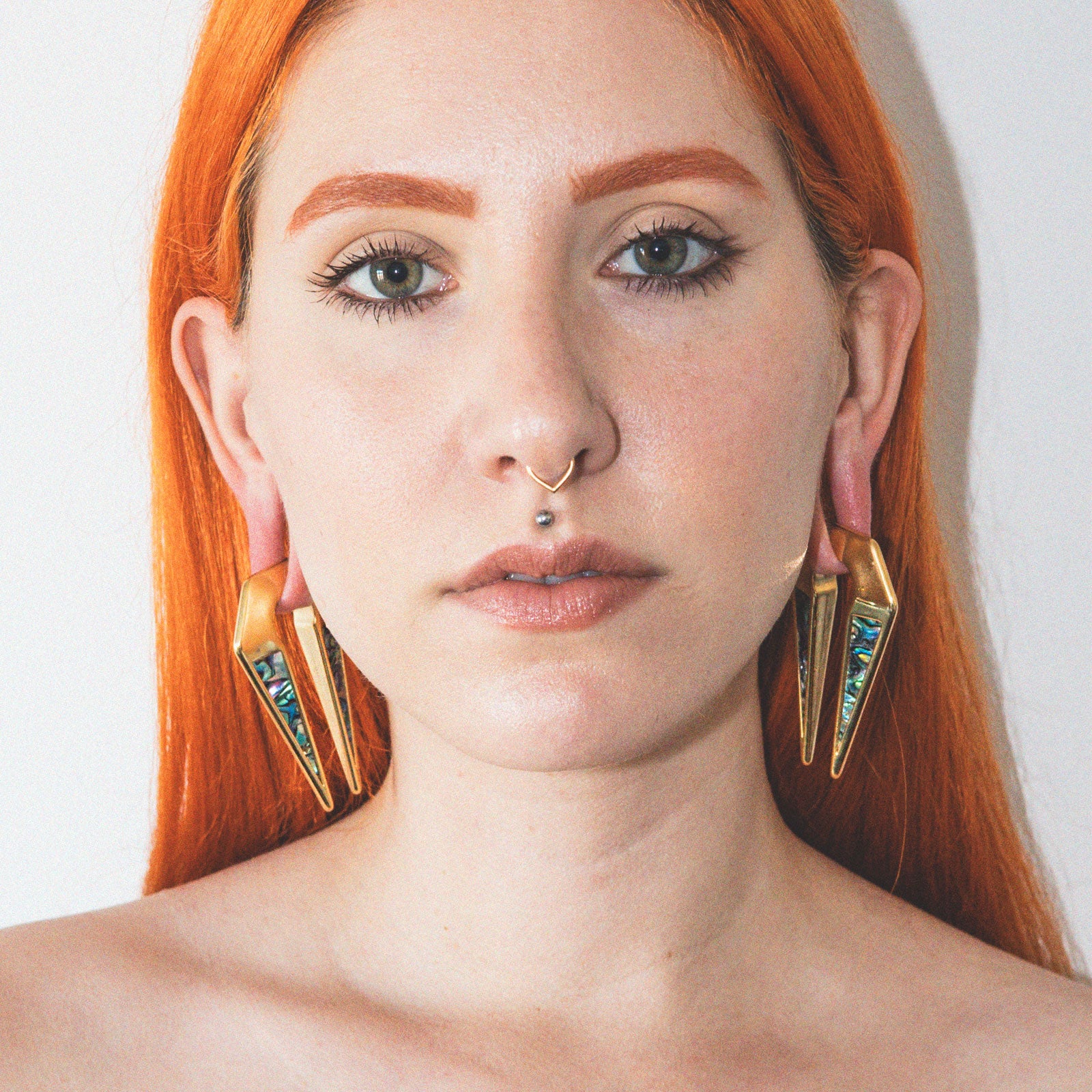 Geometric Keyhole Shell & Gold PVD Ear Weight Model Shot