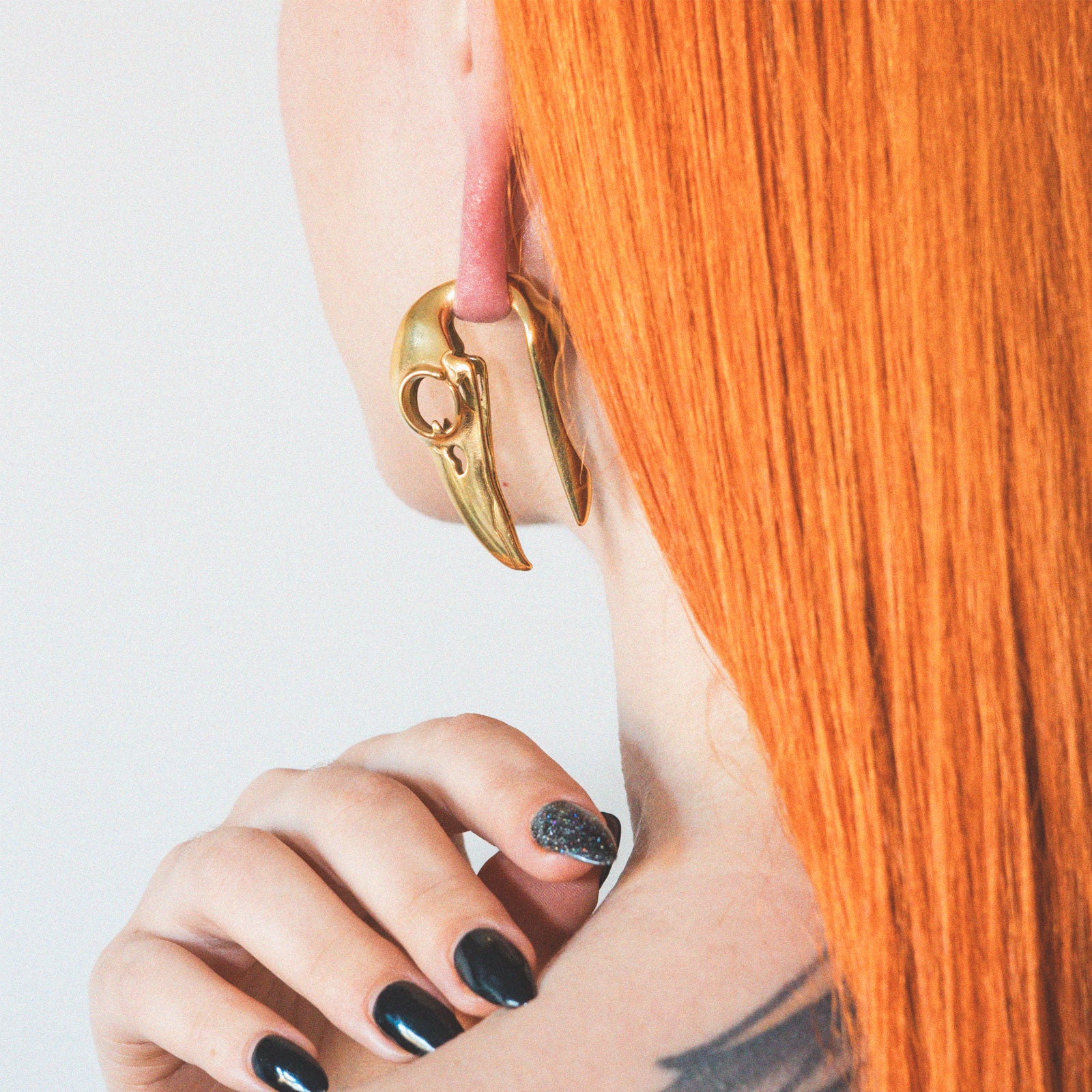 Gold PVD Bird Skull Ear Weight Model Shot Close Up