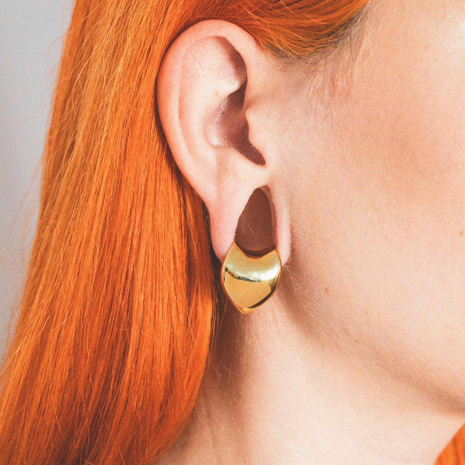 Gold PVD Saddle Ear Weight Hanger Model Shot