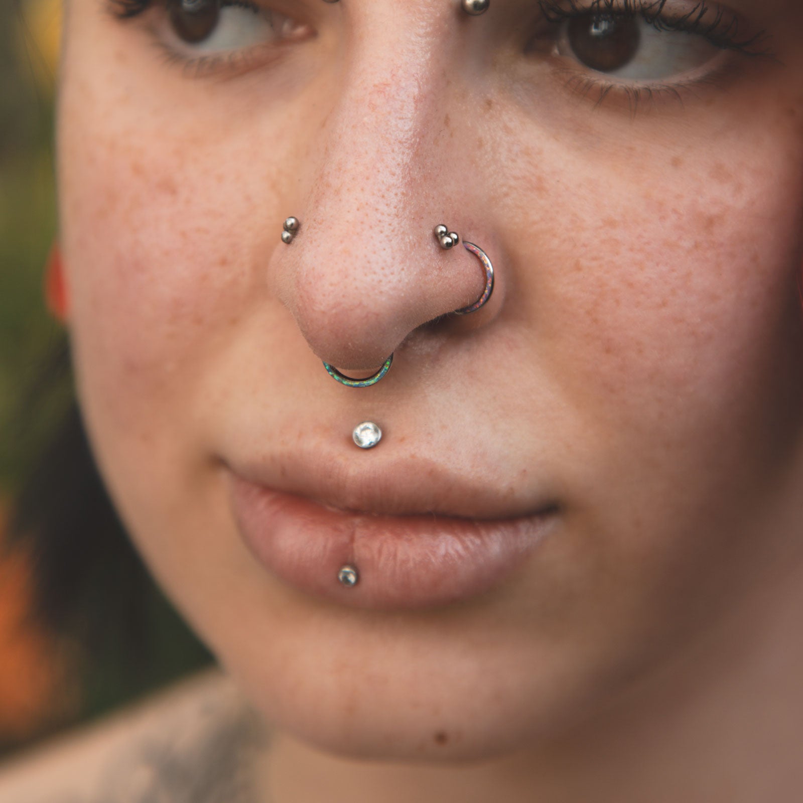 Inlaid Cornflower Blue Synth Opal Titanium Septum Clicker Model Shot