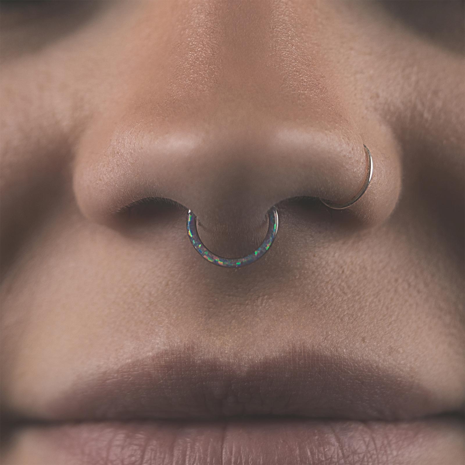 Inlaid Fire & Snow Synth Opal Titanium Septum Clicker Model Shot
