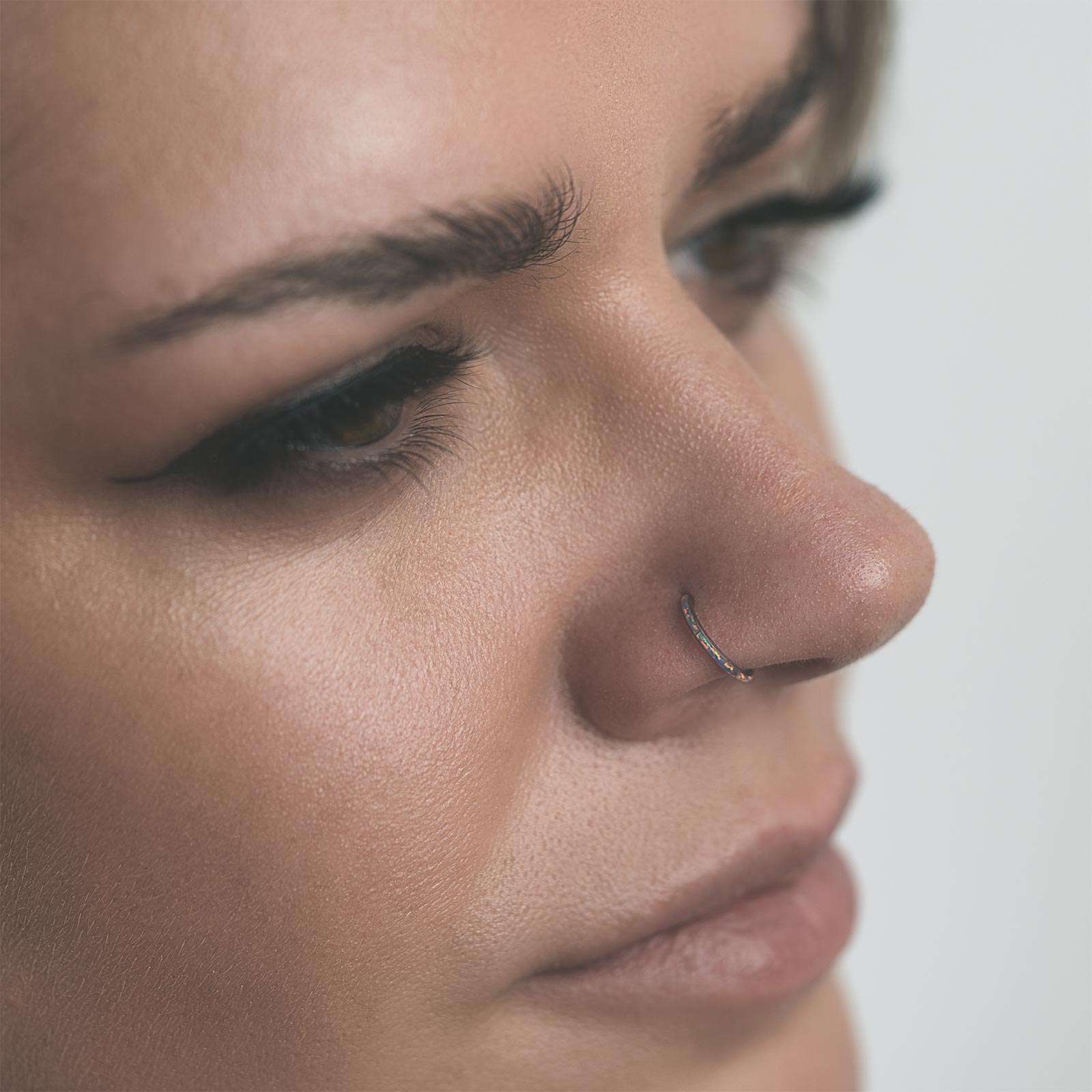 Inlaid Flash Lavender Synth Opal Titanium Hinged Segment Ring Model Shot