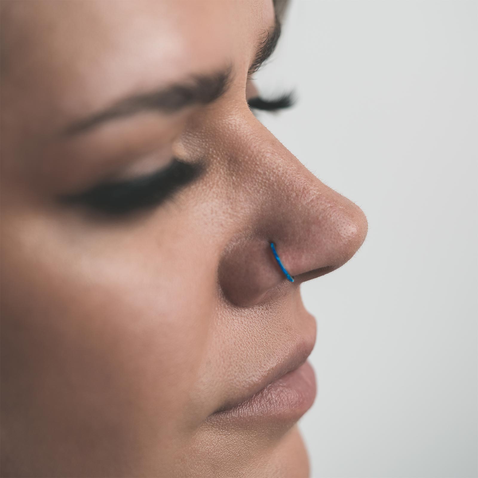 Inlaid Pacific Blue Synth Opal Titanium Hinged Segment Ring Model Shot