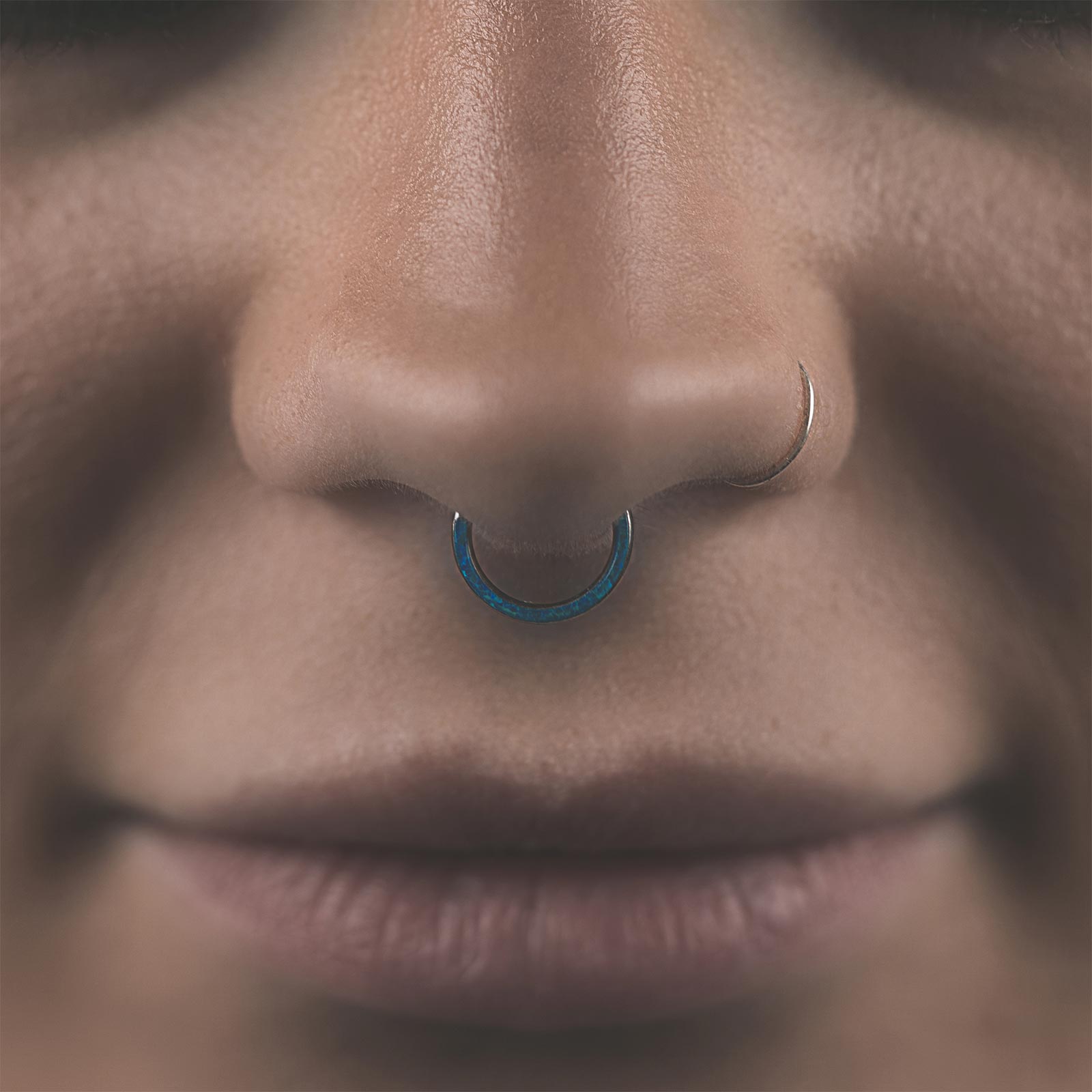 Inlaid Pacific Blue Synth Opal Titanium Septum Clicker Model Shot