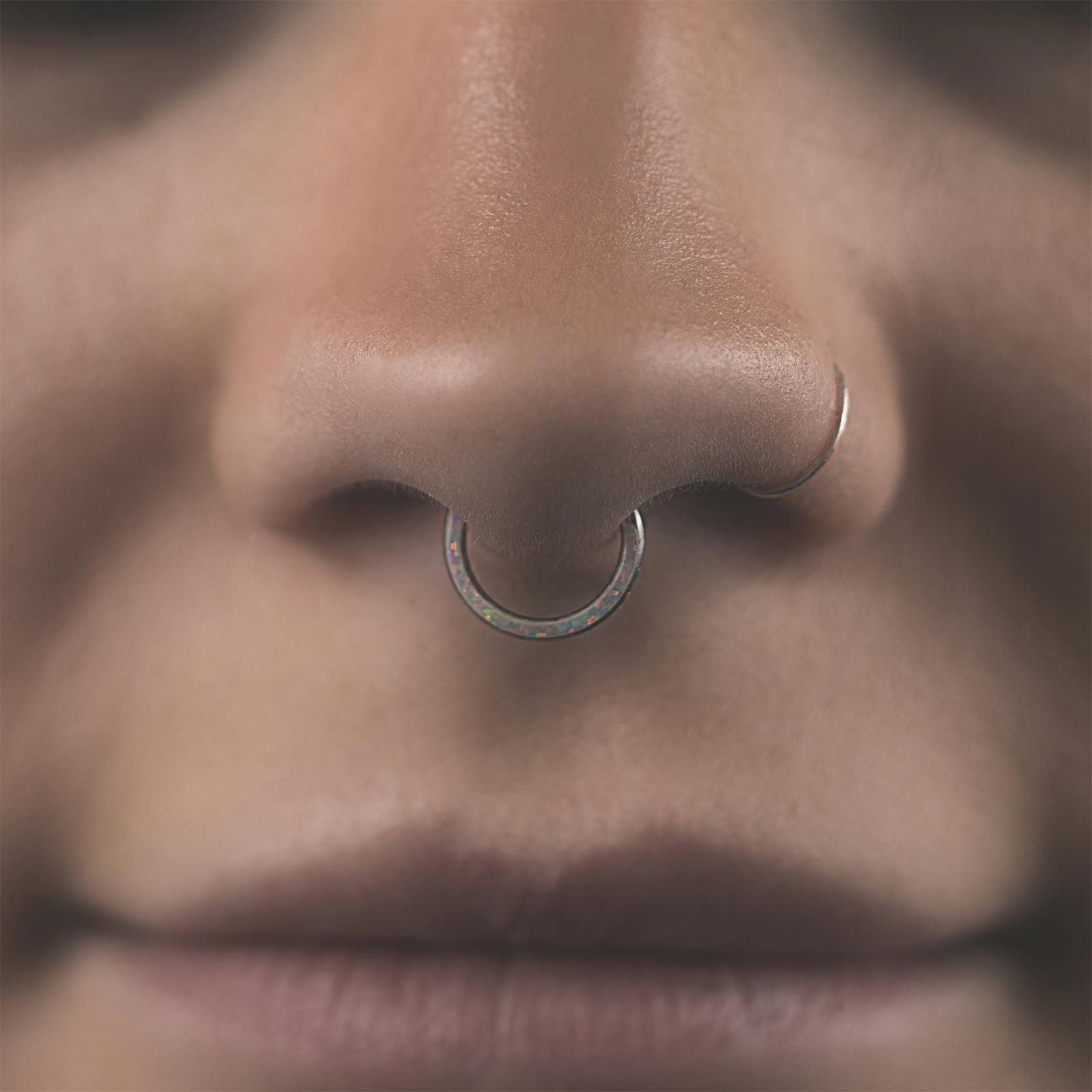 Inlaid Sun & Ice Synth Opal Titanium Septum Clicker Model Shot