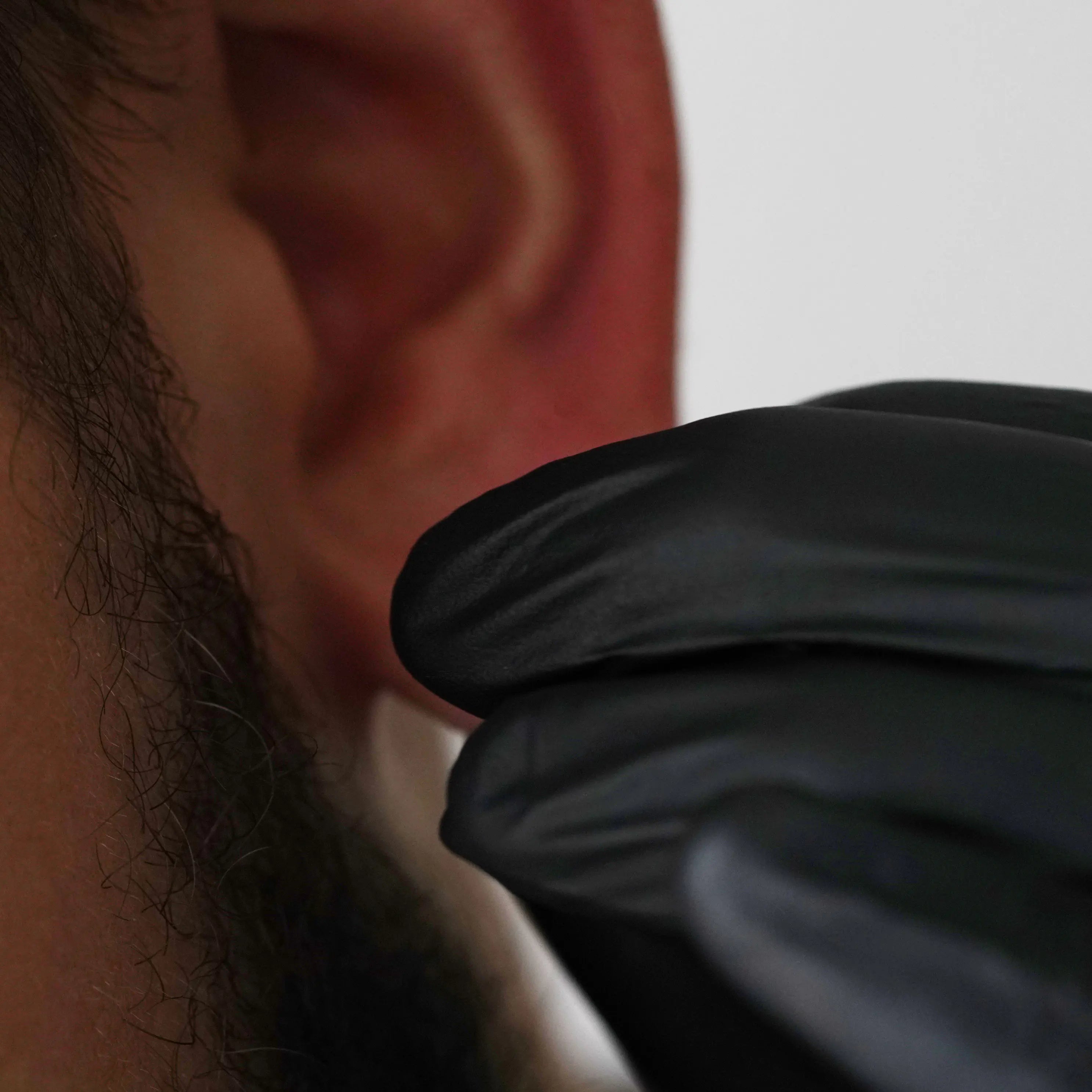 massaging lobes with jojoba oil