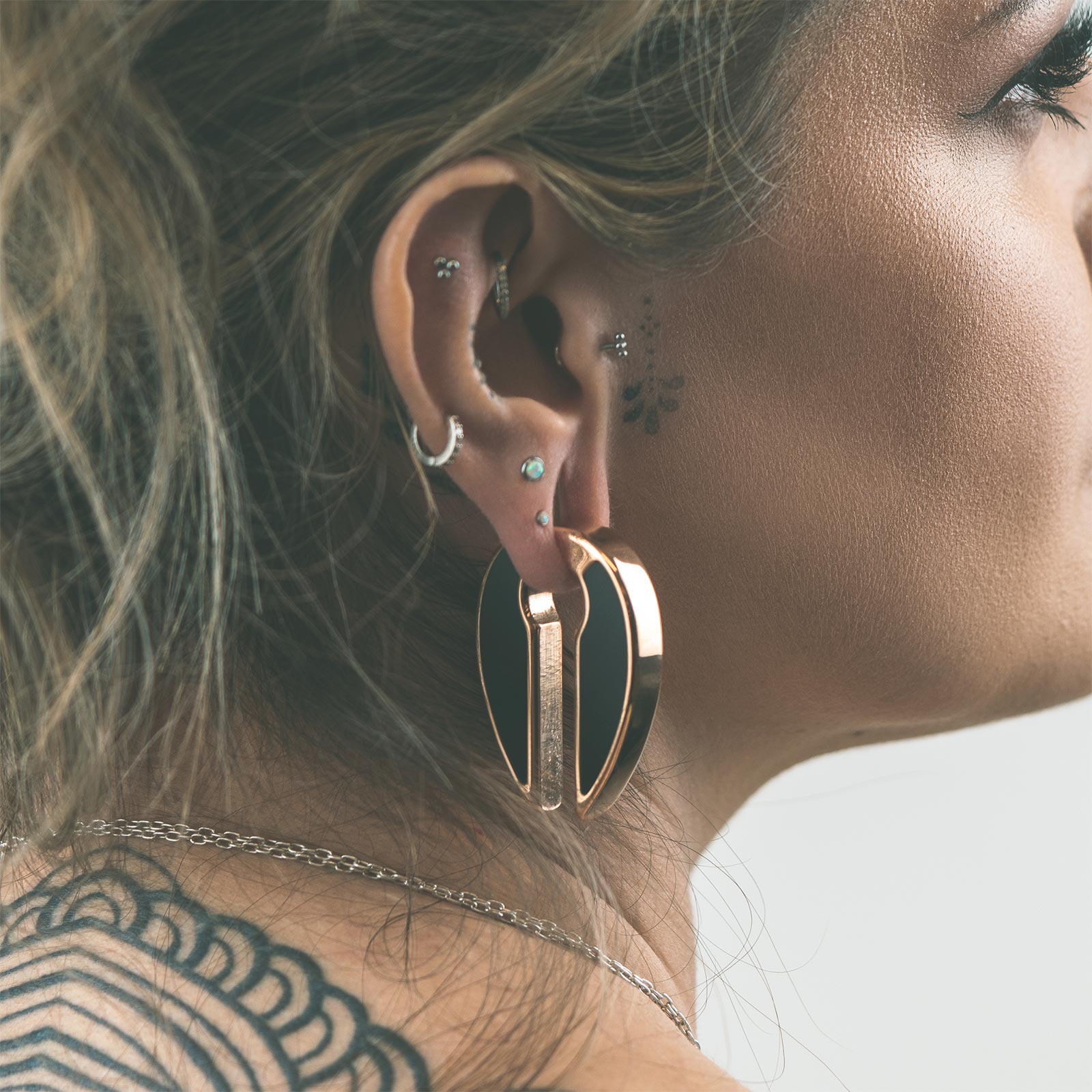 Stone Inlaid Keyhole & Rose Gold PVD Ear Weight Model Shot