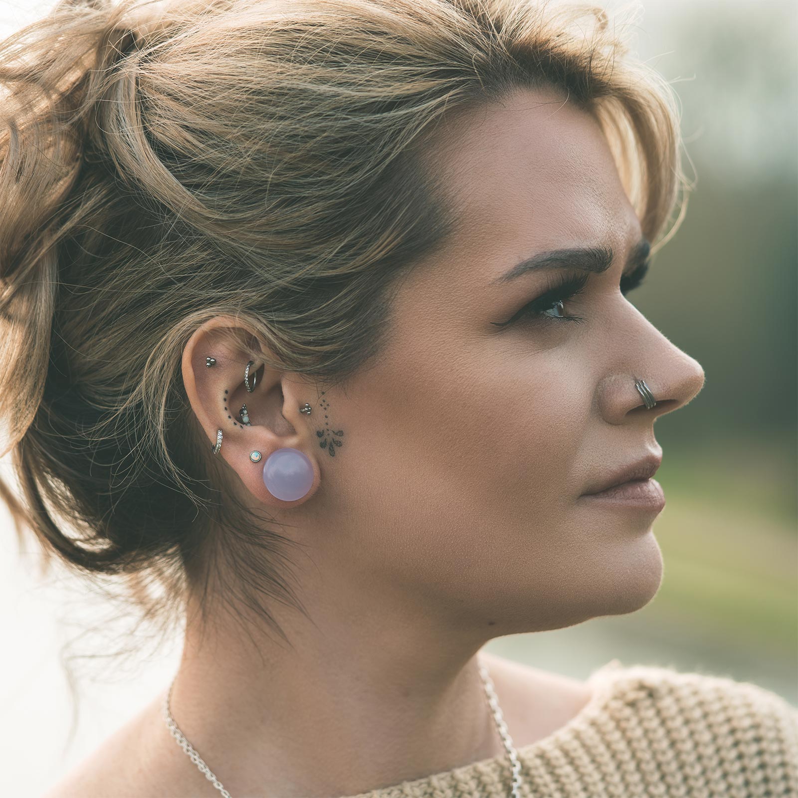 Violet Glass Single Flare Convex Plug Model Shot