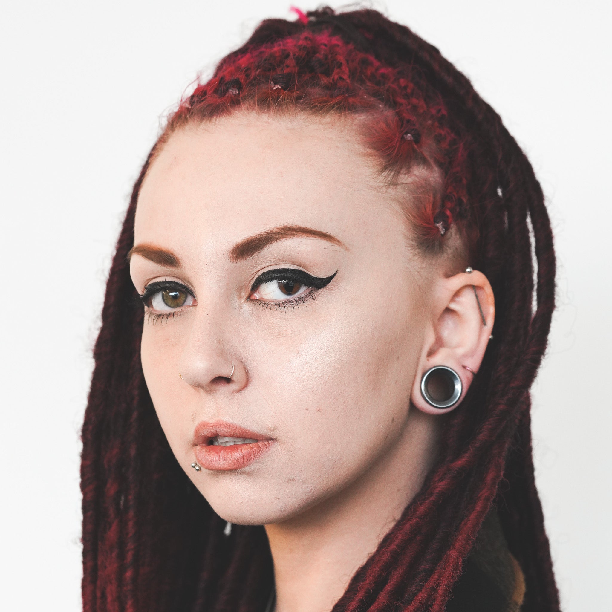 model wearing hematite stone tunnel gauges size 19mm
