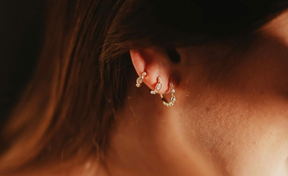 Model with lobe piercings