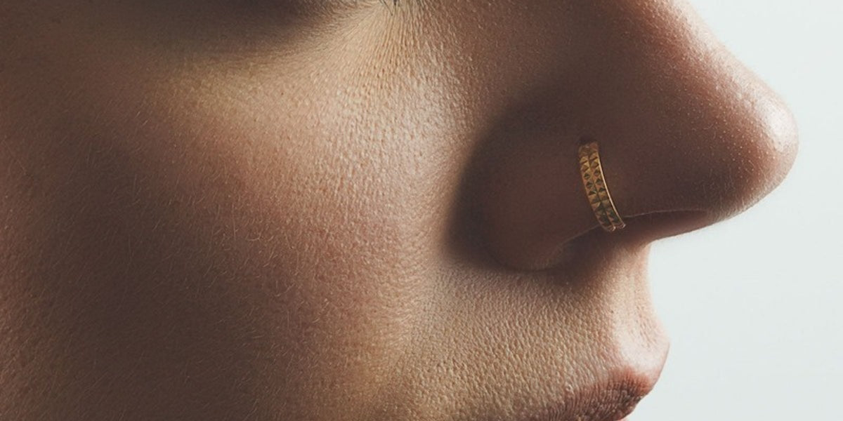 Double nose hoops - double gold hoop in a nostril piercing