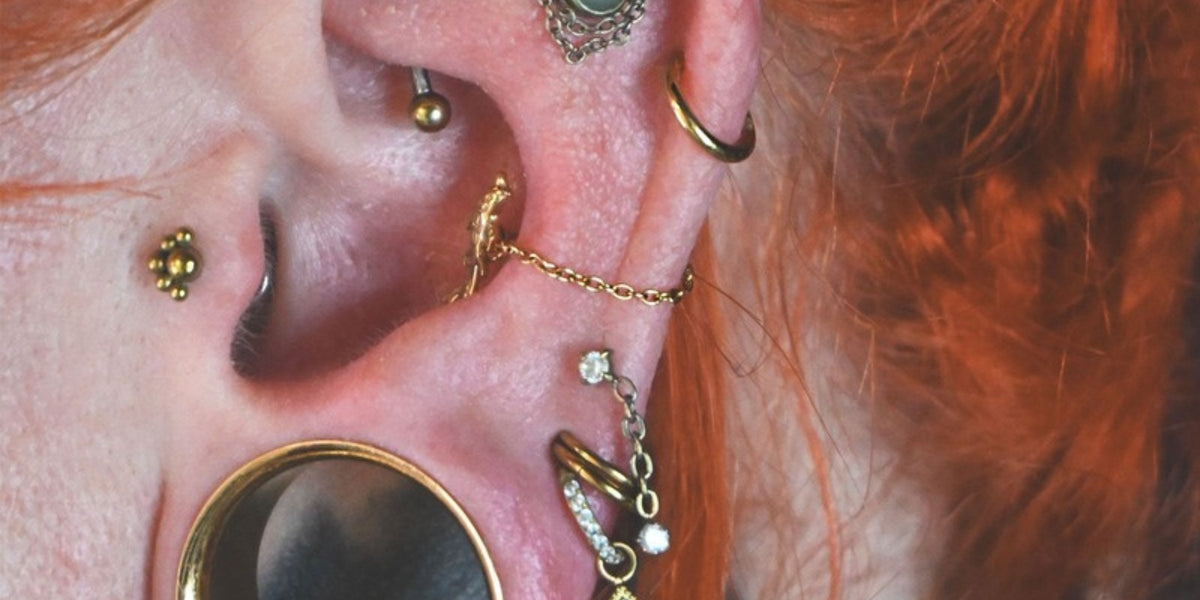 Forward helix piercing jewellery - gold rings and studs on the front of the ear