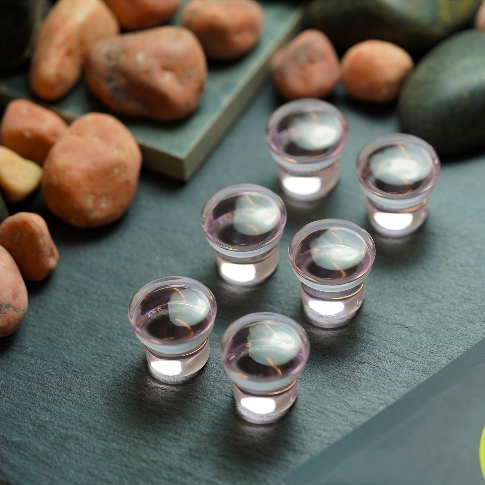 Clear Pink Glass Single Flare Convex Plug Group Shot