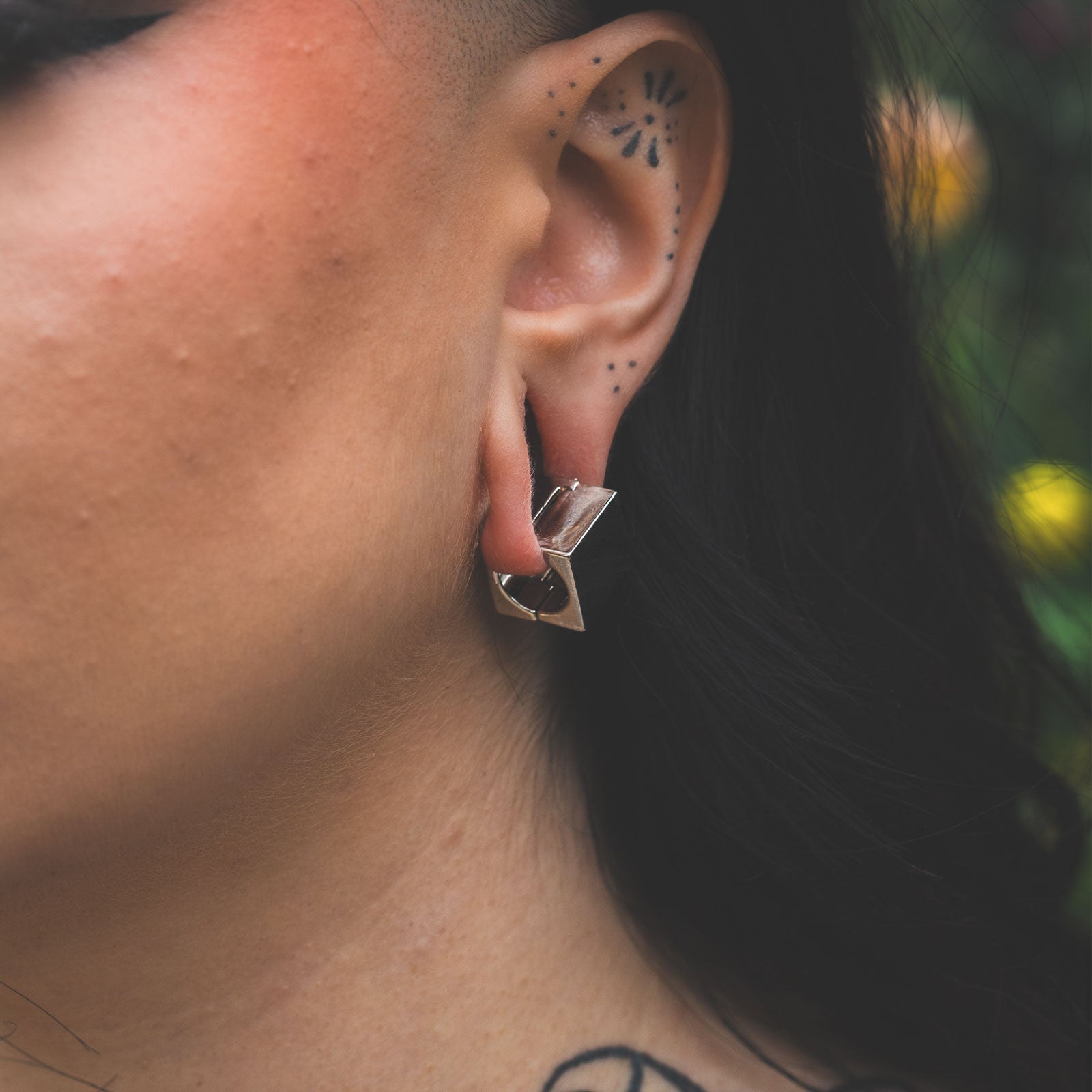 Cube Surgical Steel Ear Weight Model Shot Close Up