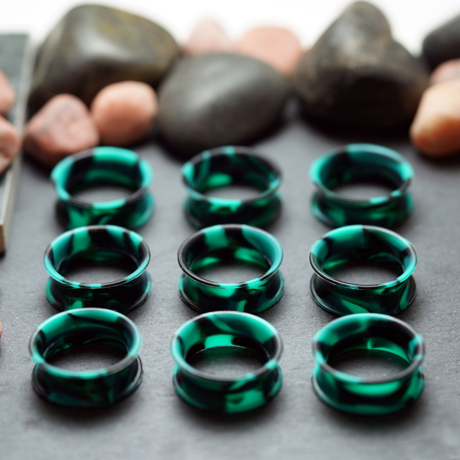 Green And Black Marble Double Flare Silicone Tunnel Group Shot Close Up