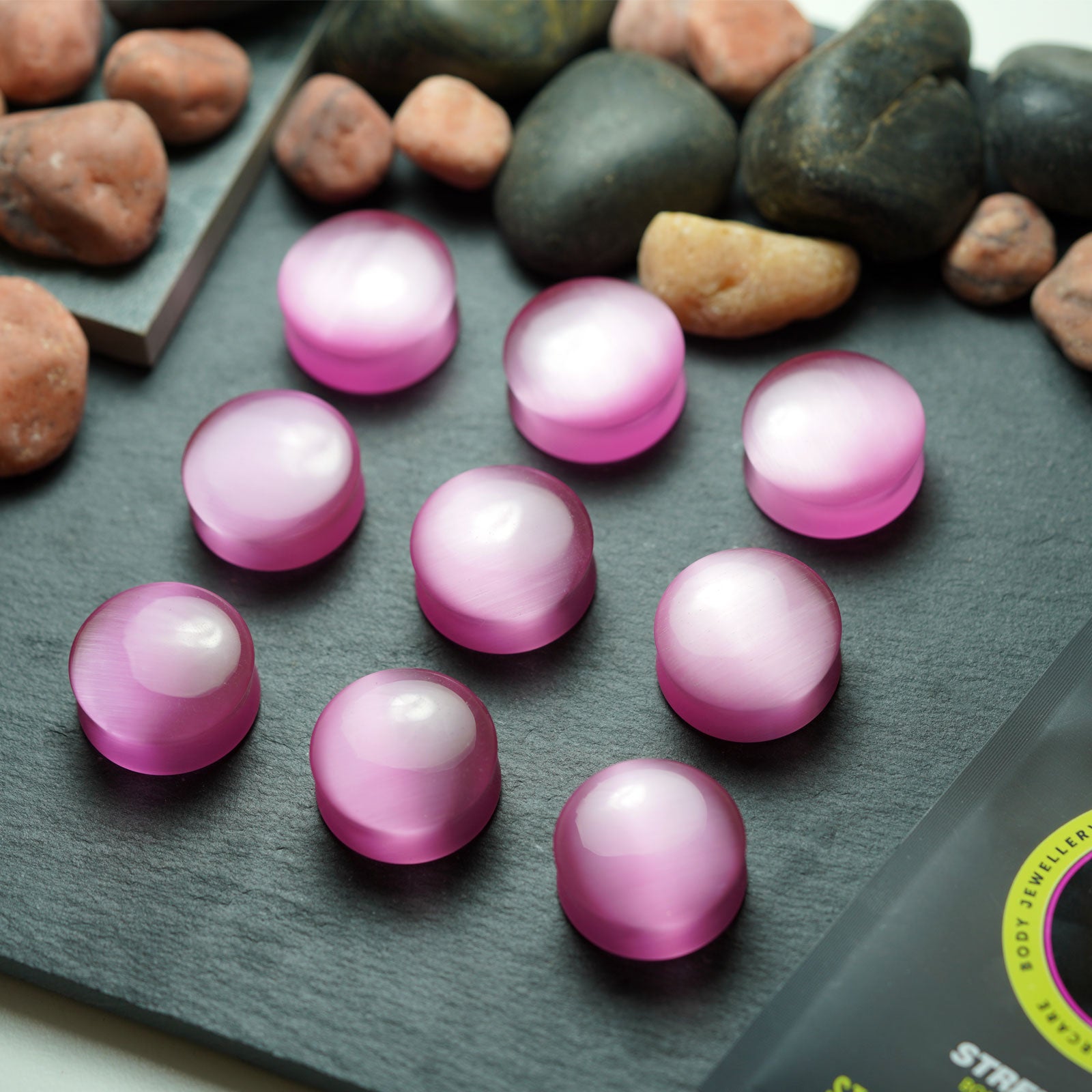 Pink Cat's Eye Glass Double Flare Convex Plug Group Shot