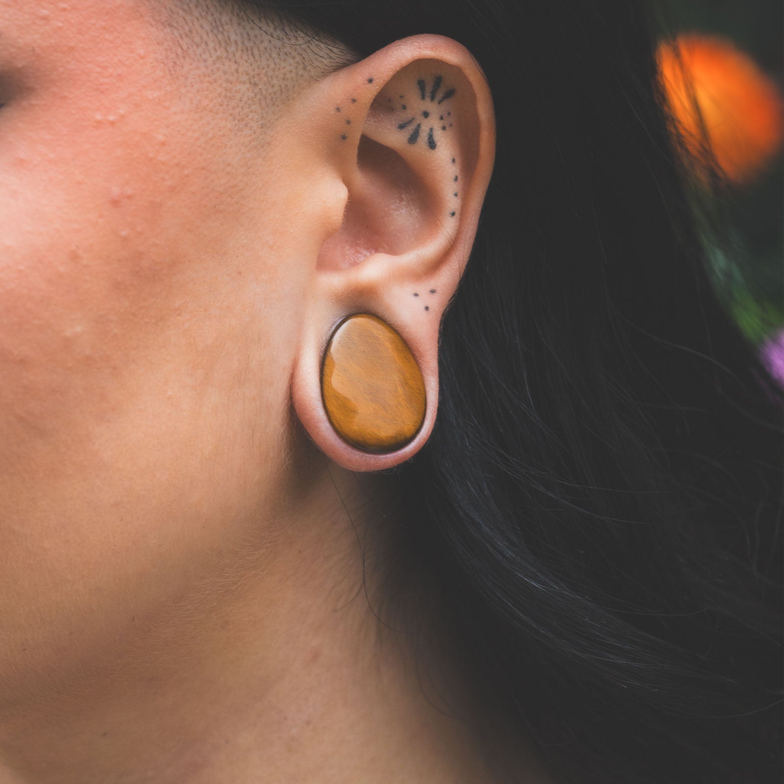 Yellow Tiger's Eye Double Flare Convex Teardrop Plug Model Shot Close Up